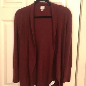 Hi! I am selling a partially used maroon sweater!